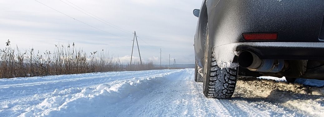 View of the rear side and tire of a car