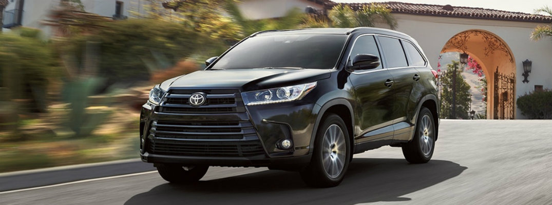 2018 Toyota Highlander driving down the road