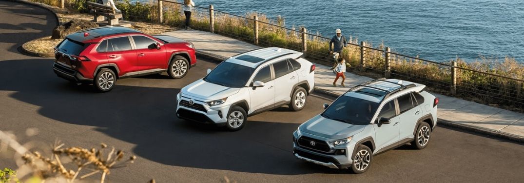 three 2020 Toyota RAV4 models parked by water's edge
