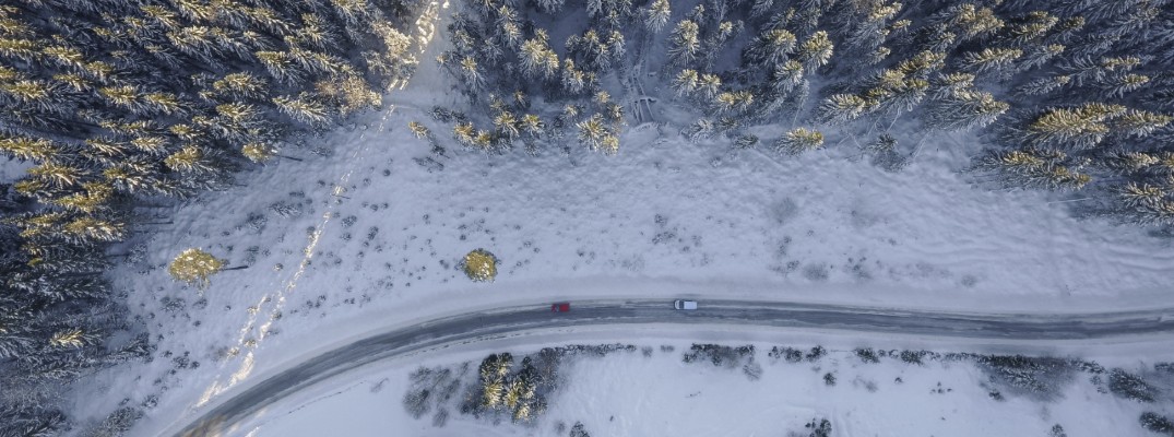View from above looking down at a snowy road
