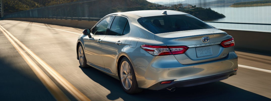 2020 Toyota Camry driving over a bridge