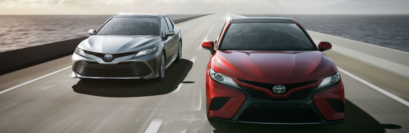 Two 2018 Toyota Camrys head on