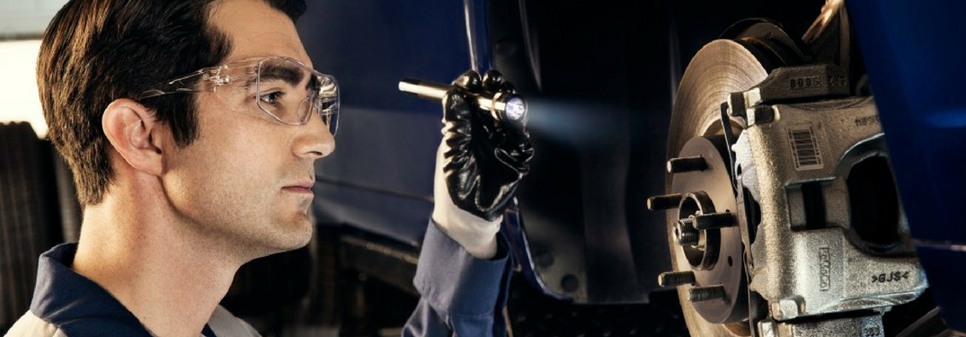 Technician inspects brake configuration