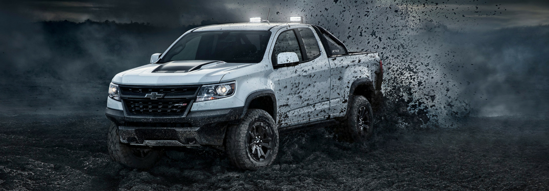 2018 Chevy Colorado ZR2 in white kicks up mud