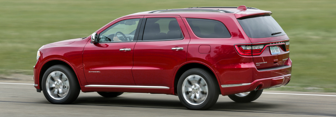 red 2018 Dodge Durango exterior driver side driving down road