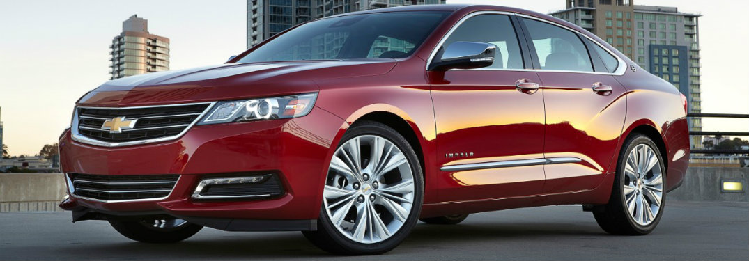 2018 Chevrolet Impala in front of a cityscape