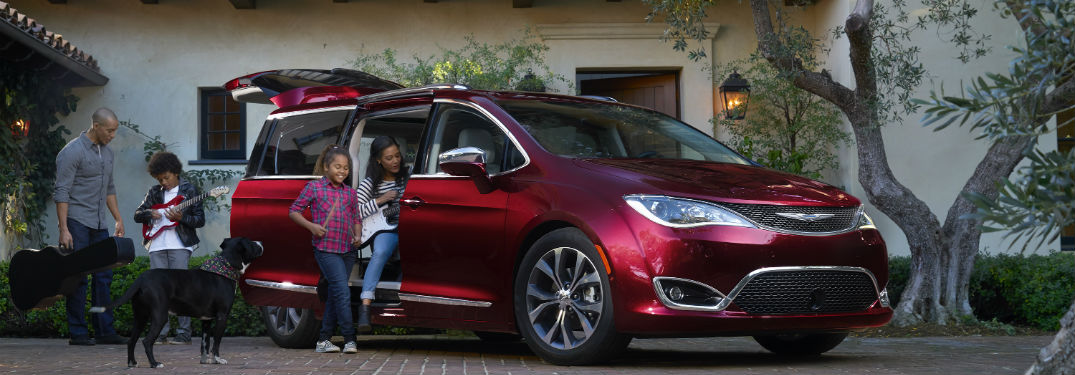 A family getting inside a 2018 Chrysler Pacifica