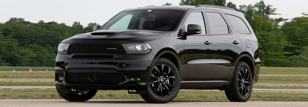 2019 Dodge Durango Trim Level Highlights with image of new 2019 Dodge Durango parked by grass clearing