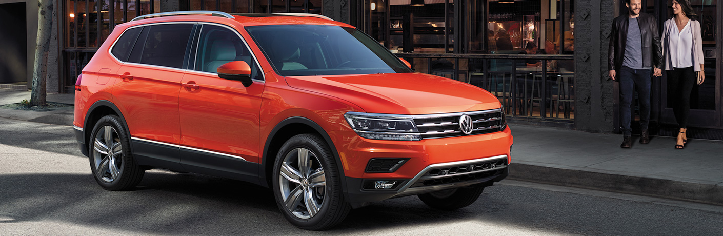 Orange 2018 Volkswagen Tiguan parked outside of a store