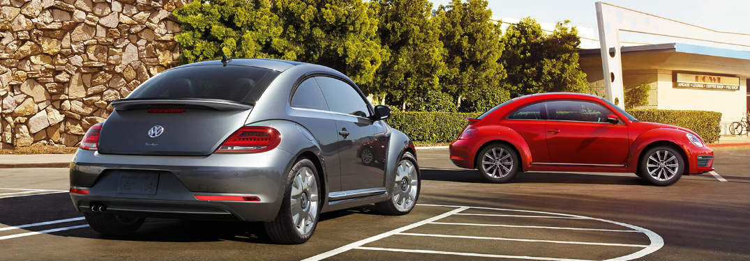 Two 2018 Volkswagen Beetles parked in a parking lot