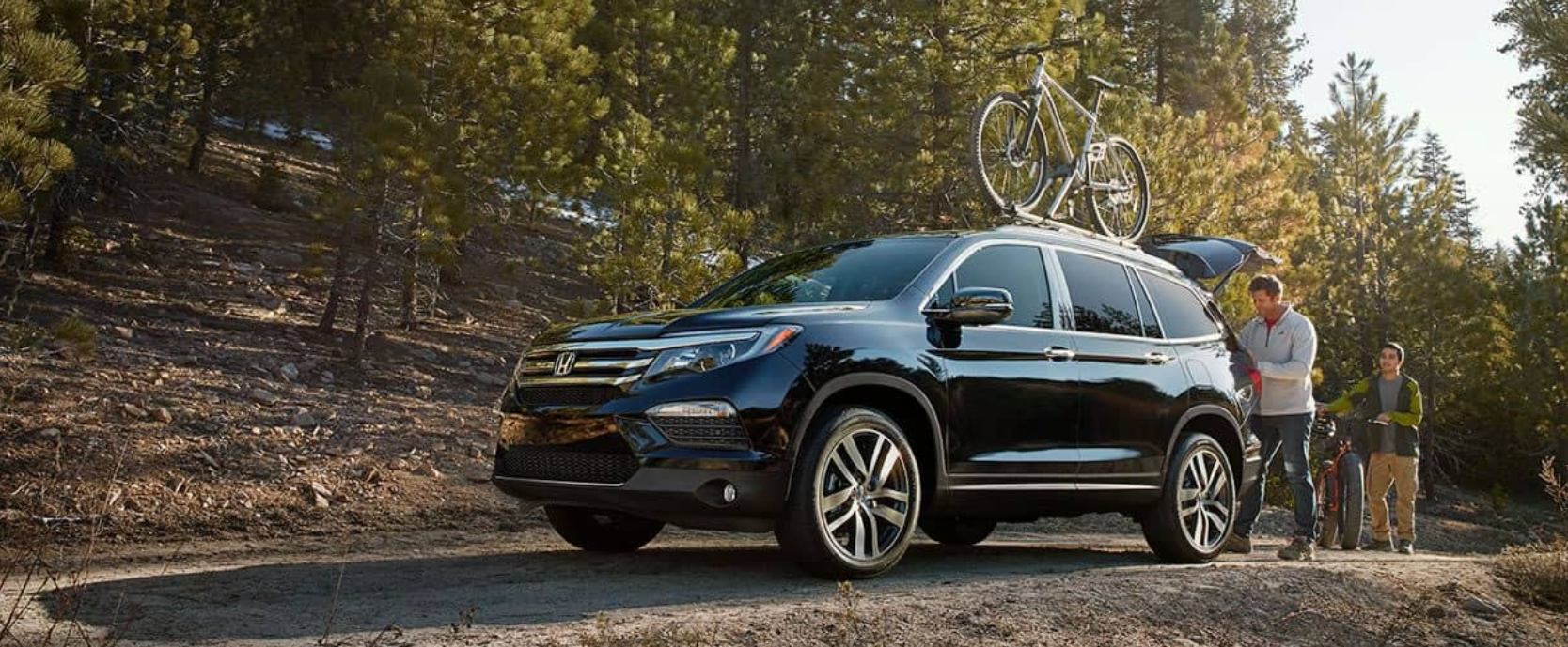 2018 Honda Pilot in blue with bike rack