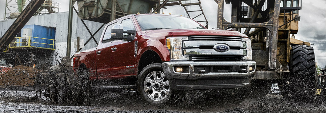 red-2017-Ford-F-250-driving-through-mud-at-work-site