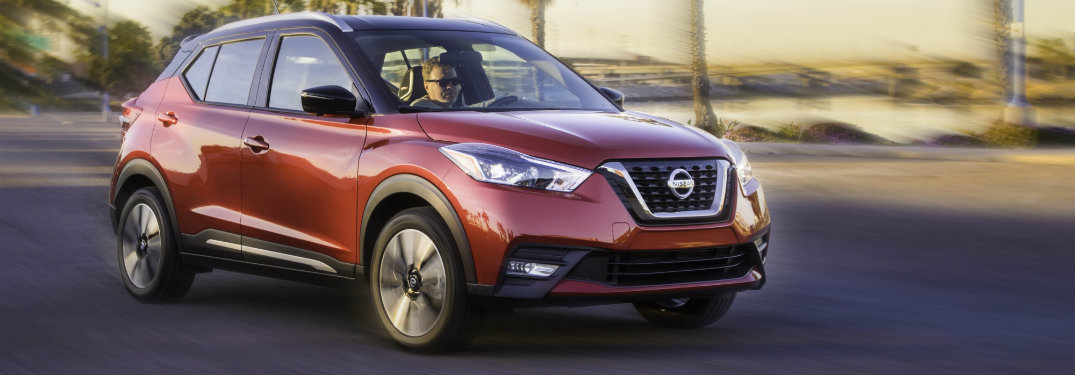 dark orange nissan kicks driving