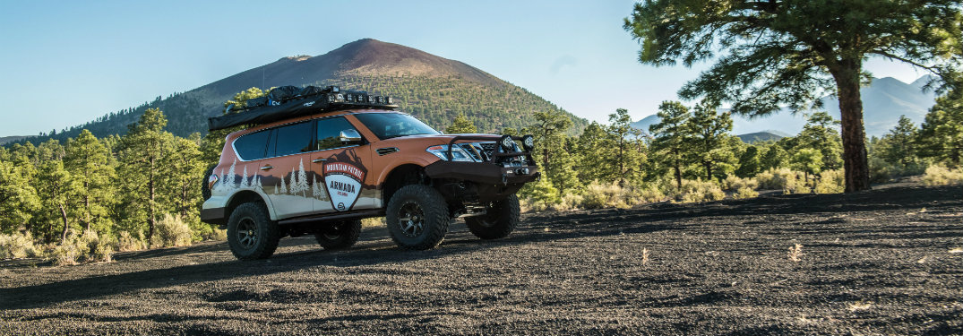 nissan armada mountain patrol on dirt by mountain