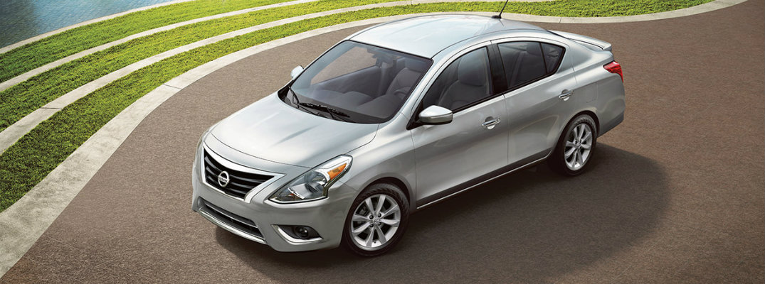 Silver 2018 Nissan Versa parked on waterfront