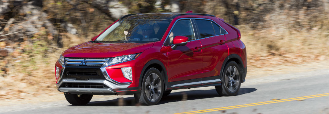 Driver side exterior view of a red 2018 Mitsubishi Eclipse Cross