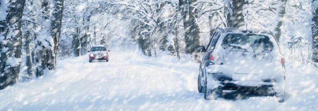 Cars driving through a harsh blizzard