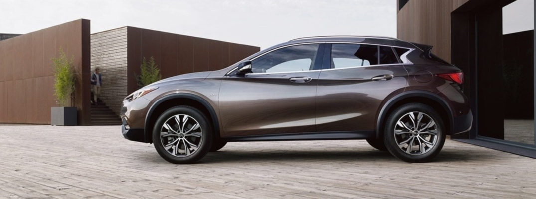 Exterior view of a graphite shadow 2019 INFINITI QX30 parked in a driveway
