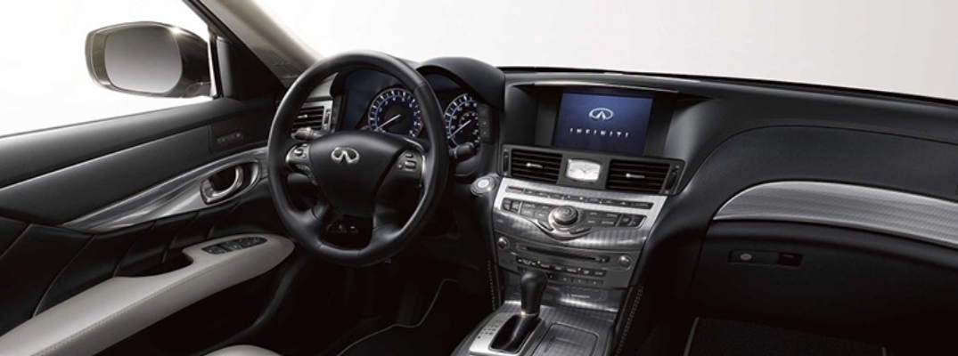 Interior view of the steering wheel and touchscreen inside a 2019 INFINITI Q70L