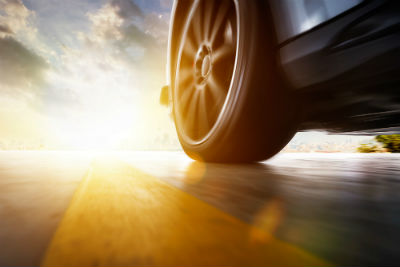 close up on tire of car driving