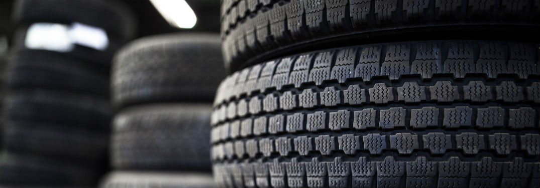 three stacks of tires at a tire store
