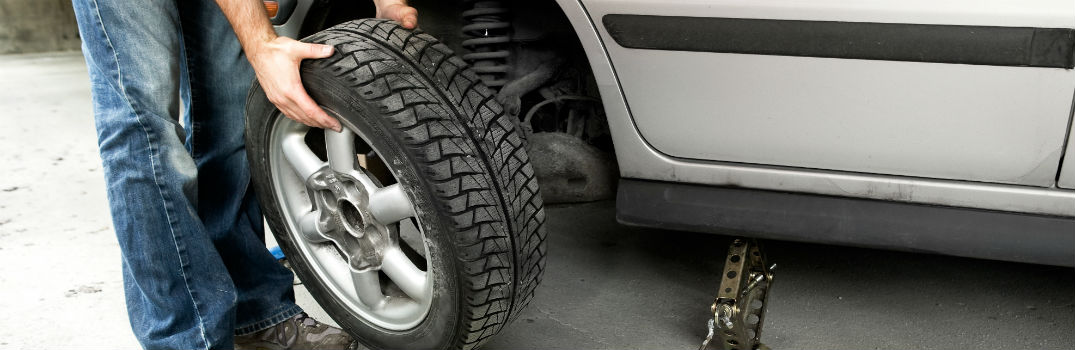 Mechanic doing Tire Rotation