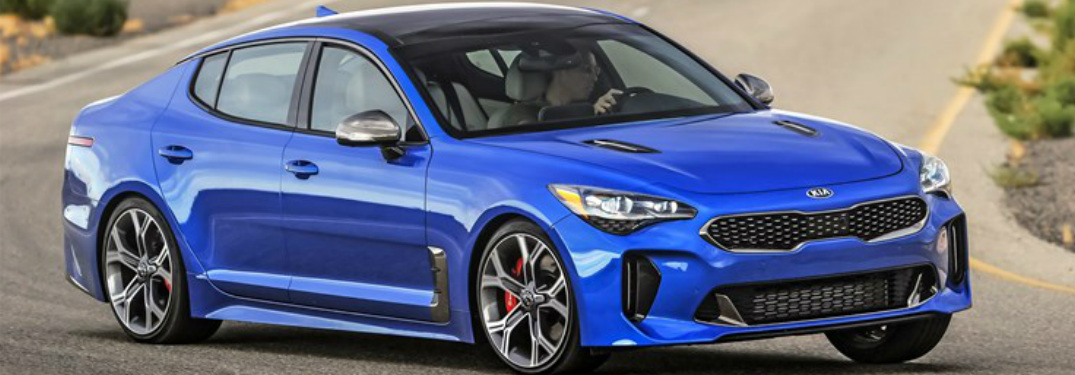 2018 Kia Stinger in blue turning a sharp corner