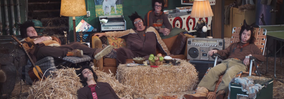 guys who look like horses sitting around in hay pile