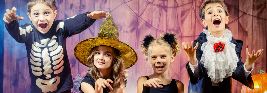 kids dressed in halloween costumes
