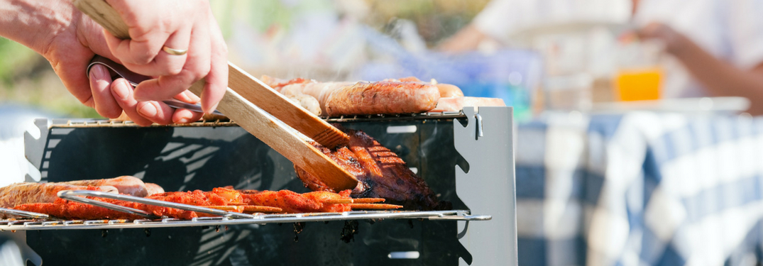 dad grilling outside for family