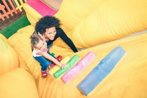 dad-and-daughter-climbing-inflatable-playground