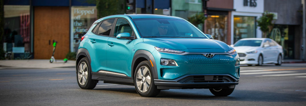 2019 Hyundai Kona EV exterior front fascia and passenger side on town road