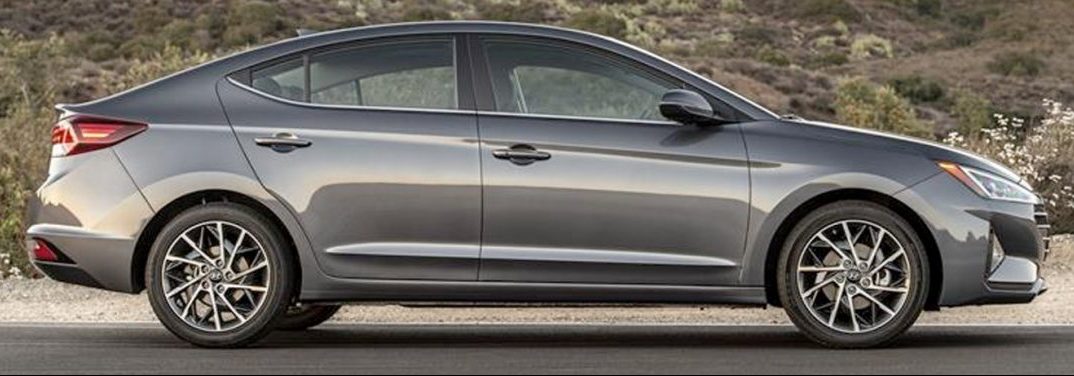 Grey 2019 Hyundai Elantra exterior side-view on a country road.