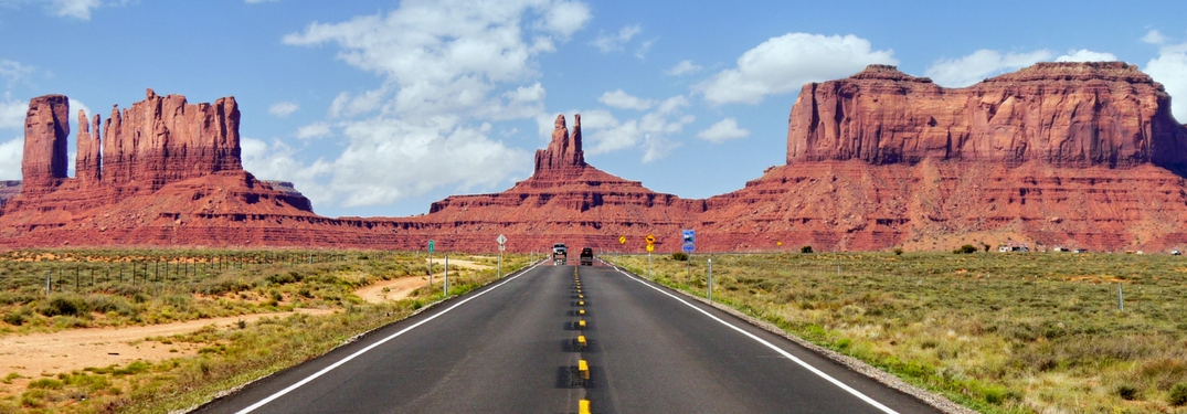 road going through mountain and mesa
