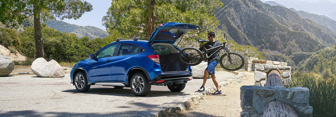 Man putting a bicycle in a 2019 Honda HR-V