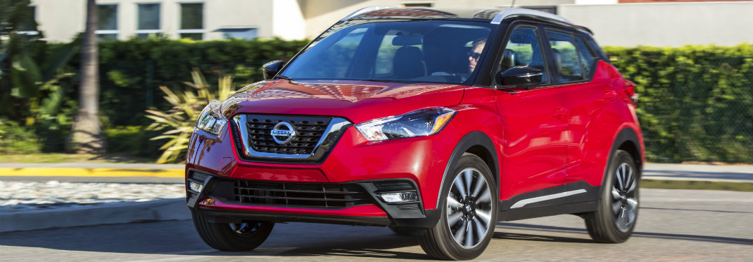 red 2018 Nissan Kicks driving, seen from the side