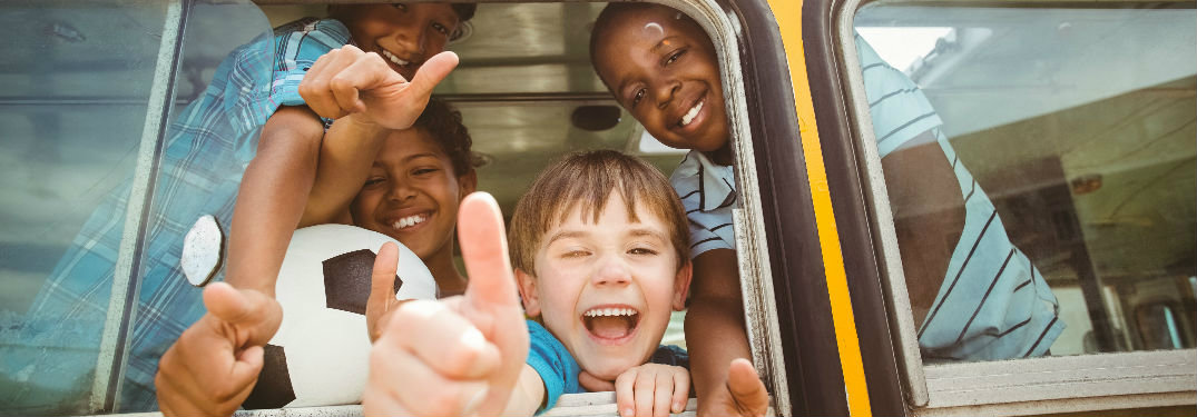 happy kids in a bus