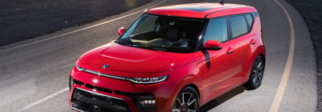 2021 Kia Soul Red driving down a rural road in Dayton, OH