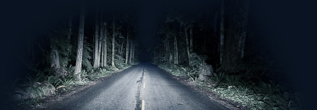 Headlights on a dark road