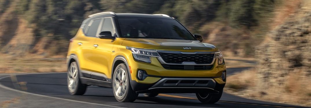 2022 Kia Seltos driving down a rural road