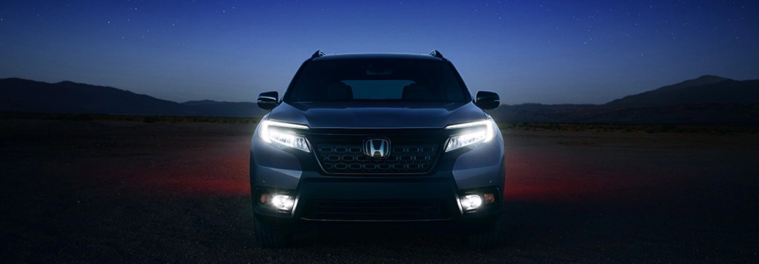 2020 Honda Passport parked on a dirt trail at night