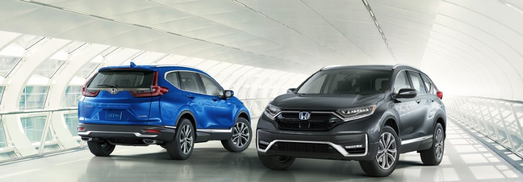 2020 Honda CR-V (blue) & CR-V Hybrid parked in white tunnel
