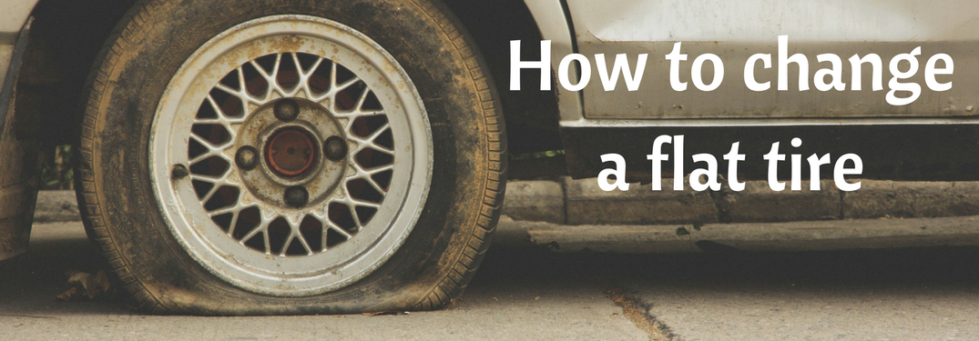 close up of flat tire, how to change a flat tire