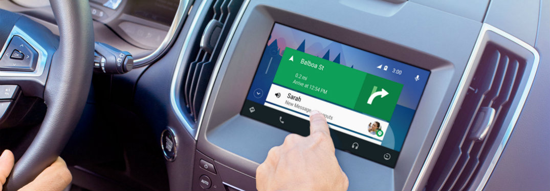 person's hand using ford sync 3 screen