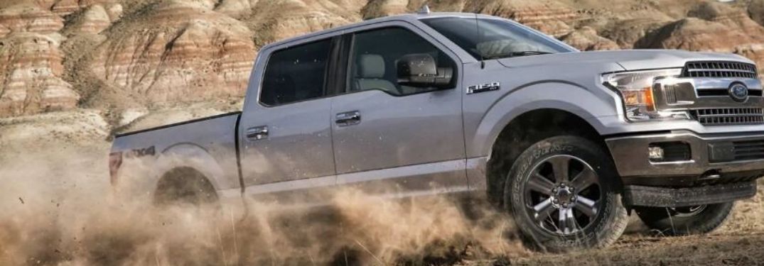 2020 Ford F-150 driving on dirt and mud