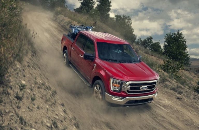 2021 Ford F-150 driving down a hill