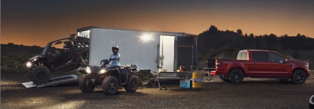 2021 Ford F-150 parked with trailer at night