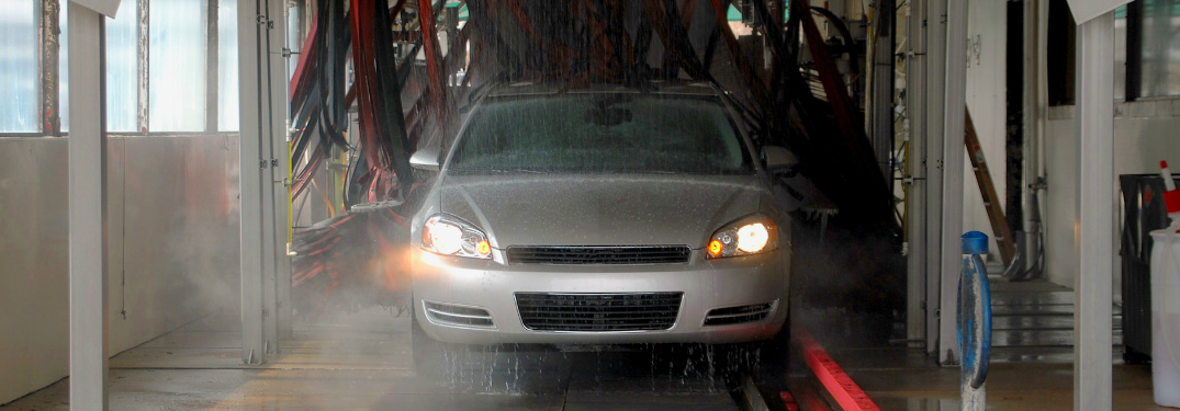Silver Sedan Riding through a Car Wash