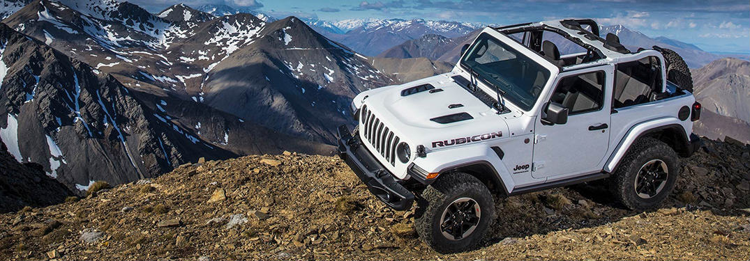 2019 Jeep Wrangler parked on the peak of a mountain