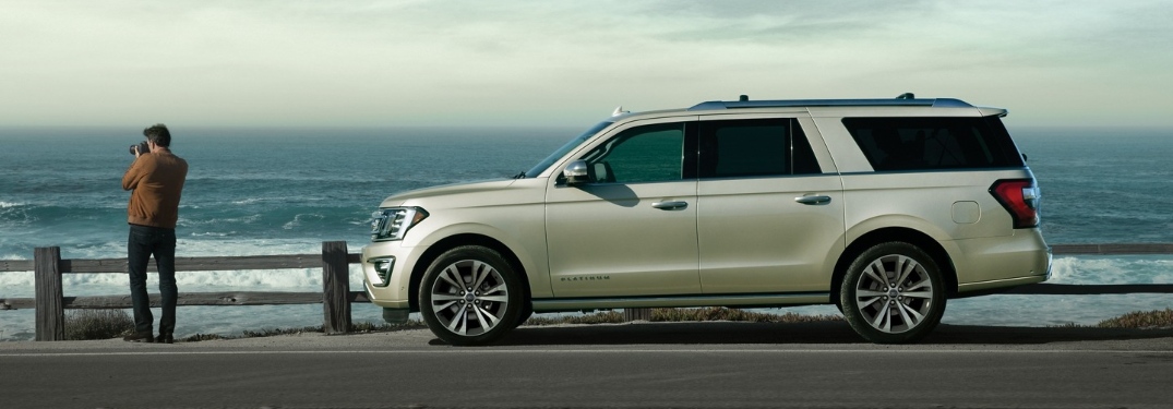 2020 Ford Expedition with man standing in front taking pictures